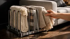 The pot lid organiser hack that keeps throw blankets tidy and easy to grab