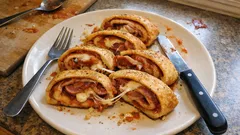 Homemade Stromboli – rolled pizza bread with tomato, cured meats and mozzarella